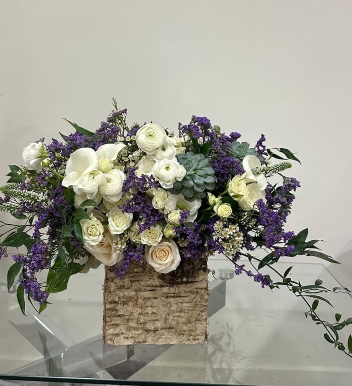 Lavender Dreams flower box with white and purple roses, ranunculus, and mixed blooms – an elegant and tranquil arrangement.